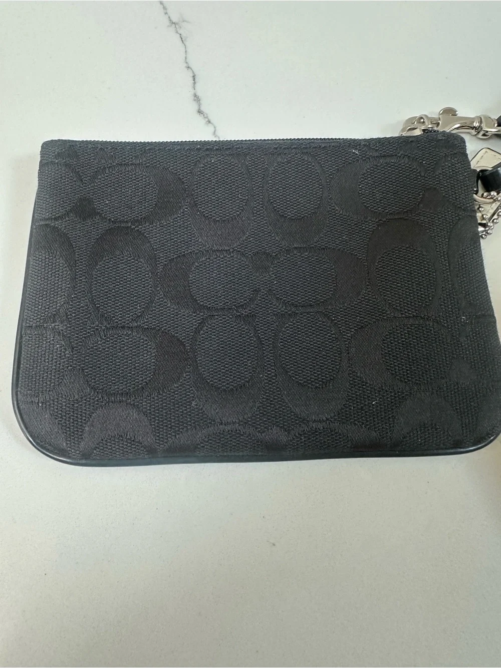 COACH Black Signature Wristlet with white coach tag